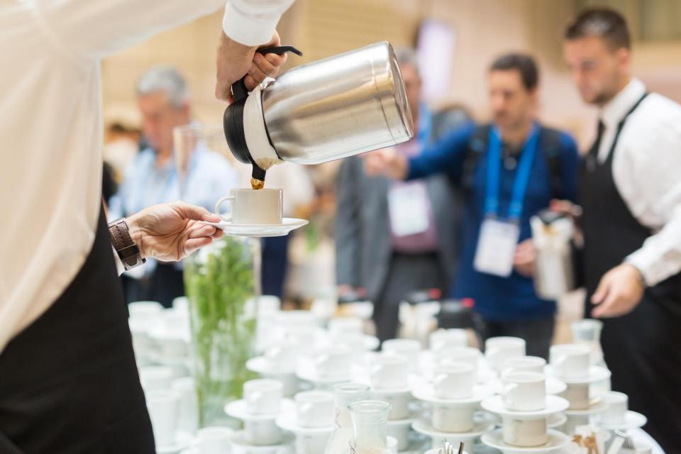 Coffee being served at conference meeting.