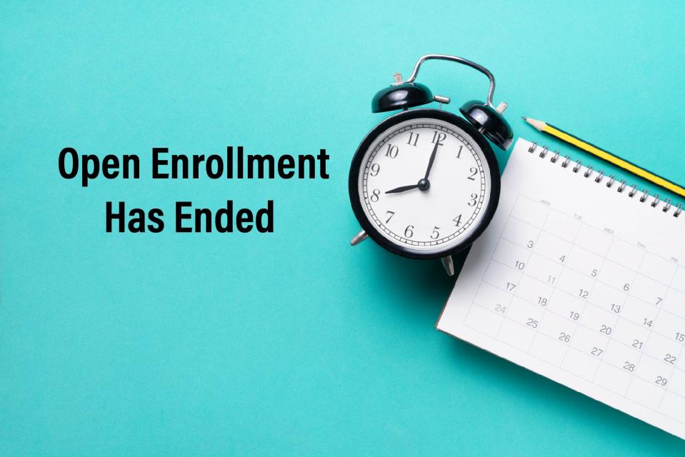 Open Enrollment has ended with clock and calendar background.